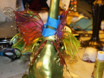 Assembling dragon wings on gourd birdhouse