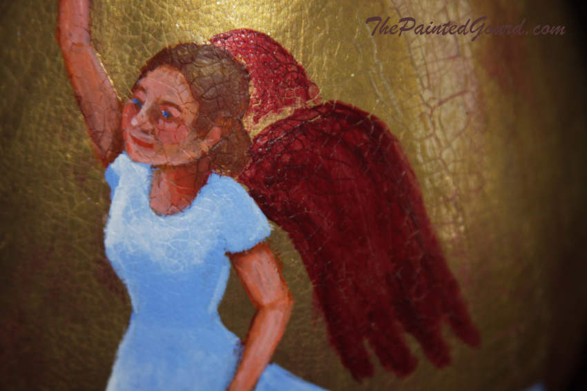 close up of angel on pear shaped gourd
